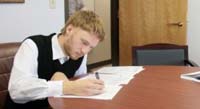 Photo of a man writing